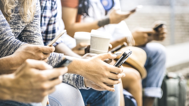 Multicultural friends group using smartphone with coffee at university college break - People hands addicted by mobile smart phone - Technology concept with connected trendy millennials - Filter image